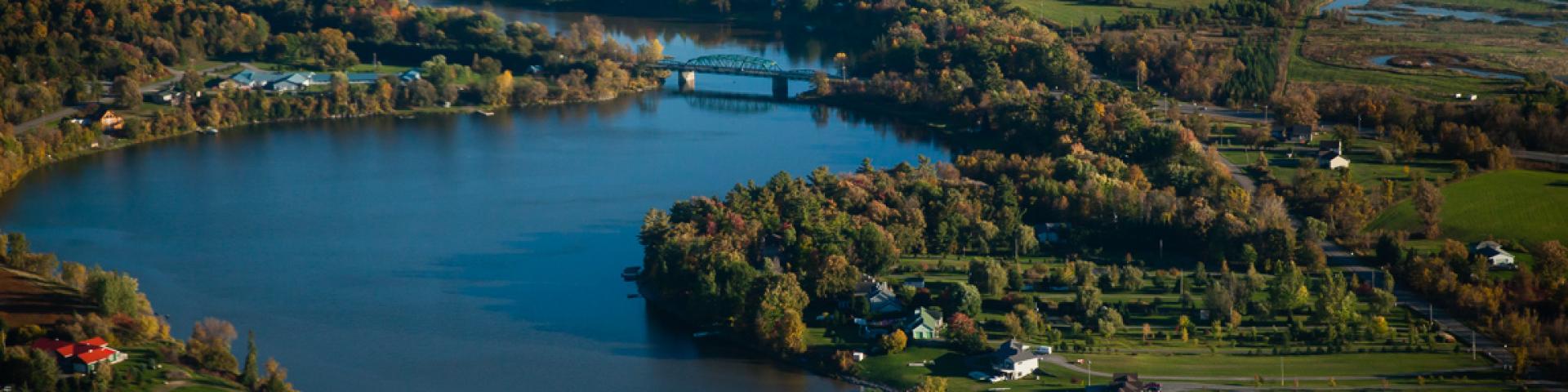 The Nation river with fields and a bridge